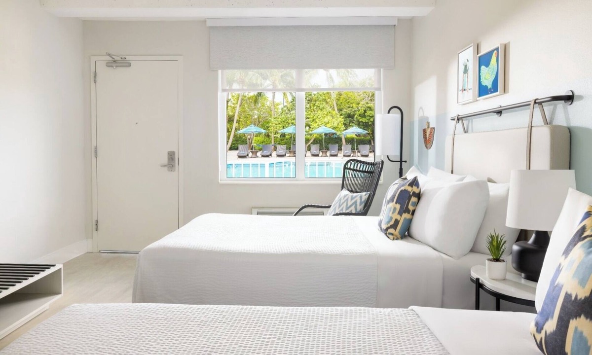 New Town Hotel | 4 Pool-view Rooms with 2 Queen Beds l Island Vibes Await in Blue Flamingo Resort
