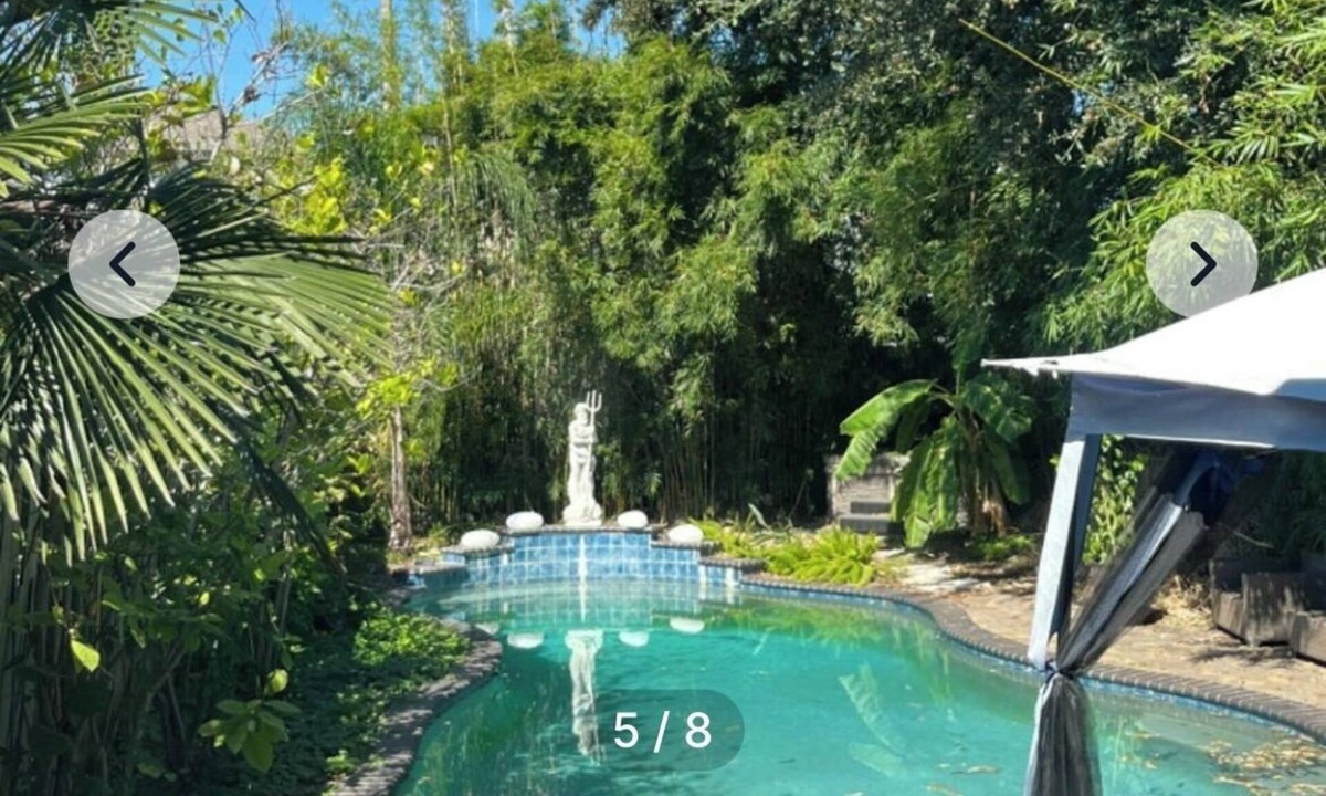 Tulane - Gravier House | bedroom and en suite bath in historic New Orleans home with pool & WiFi