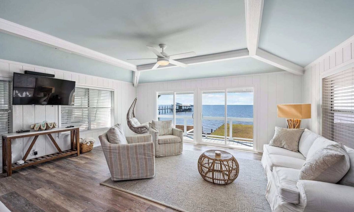 Alabama Gulf Coast Cottage | Cottage on Mobile Bay- Sleeps 8! Stunning sunset views, Large screened porch, Private Pier. Perfect for fishing or relaxing on the water!