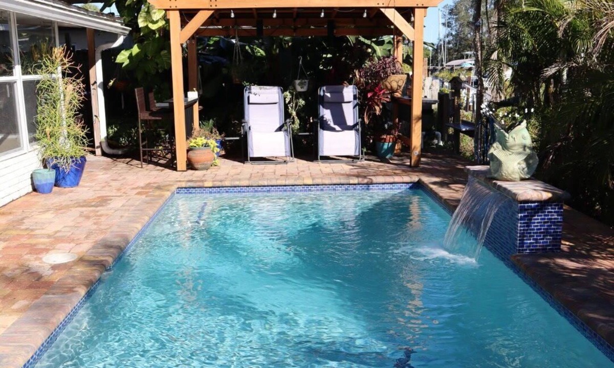 Bayshore Gardens House | Cozy canal cottage with pool, dock, Gulf access and minutes to Anna Maria Island