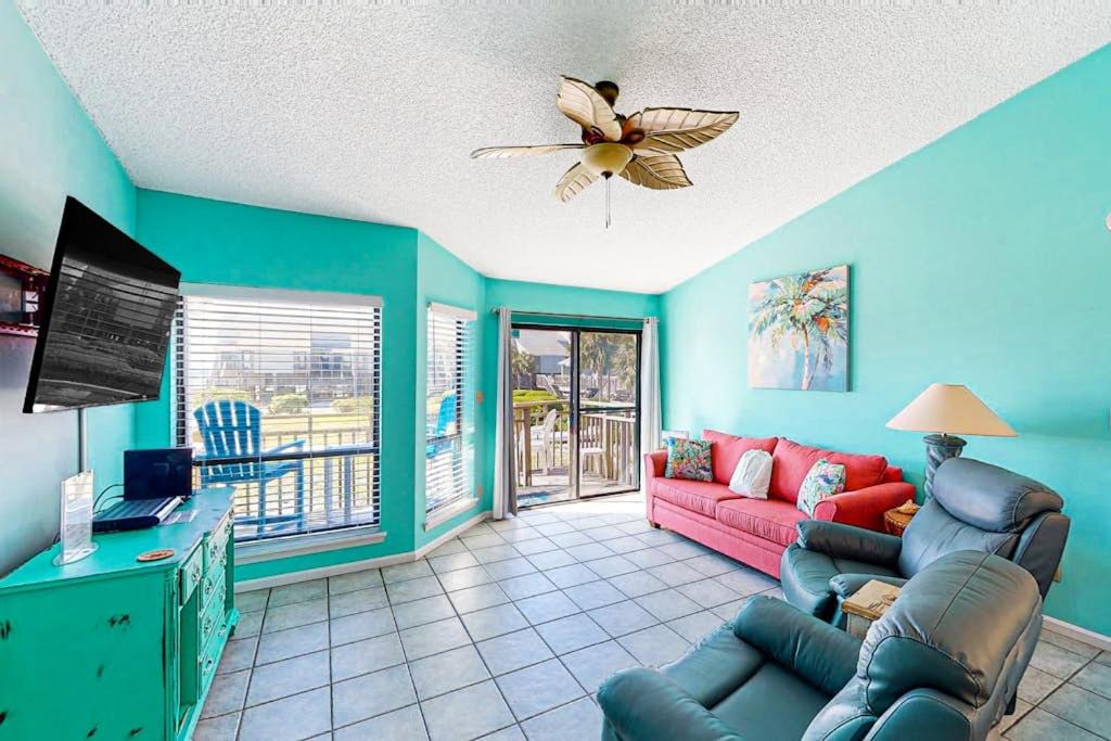 East End House | Dog-friendly poolside townhouse with community pool grills deck beach gear AC