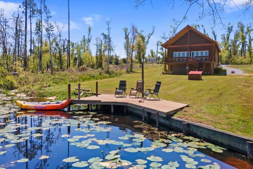 Youngstown House | Fun fishing river cabin 23mi to beach with private dock 3BD 2BA