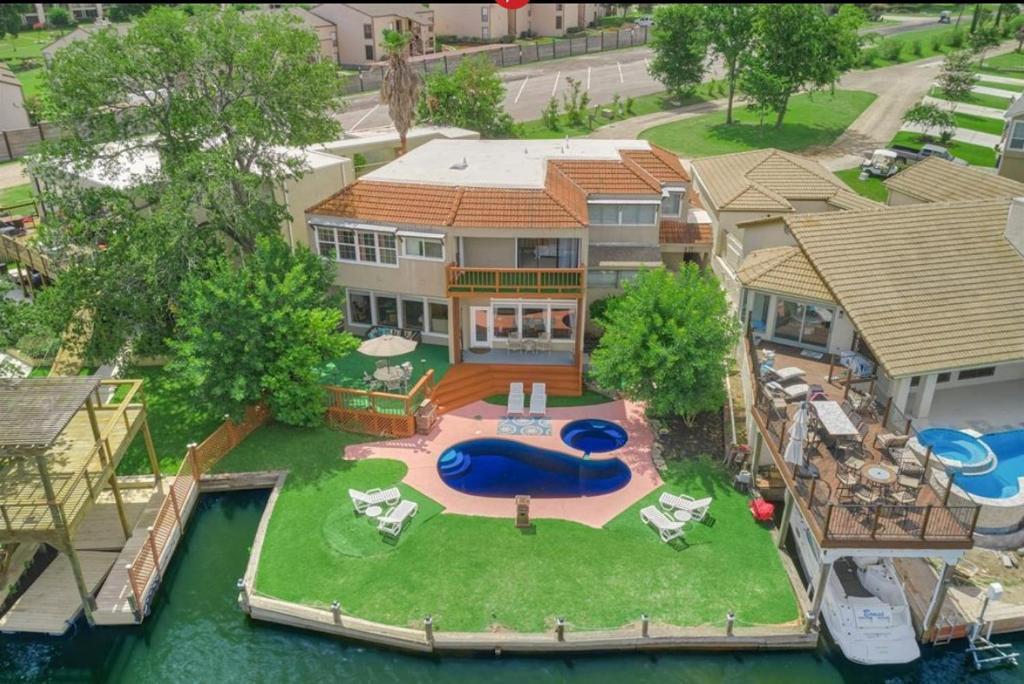 April Sound House | Lake front retreat with pool, spa, golf, fishing, boat slip, 4 bed, 4 bath sleeps 21