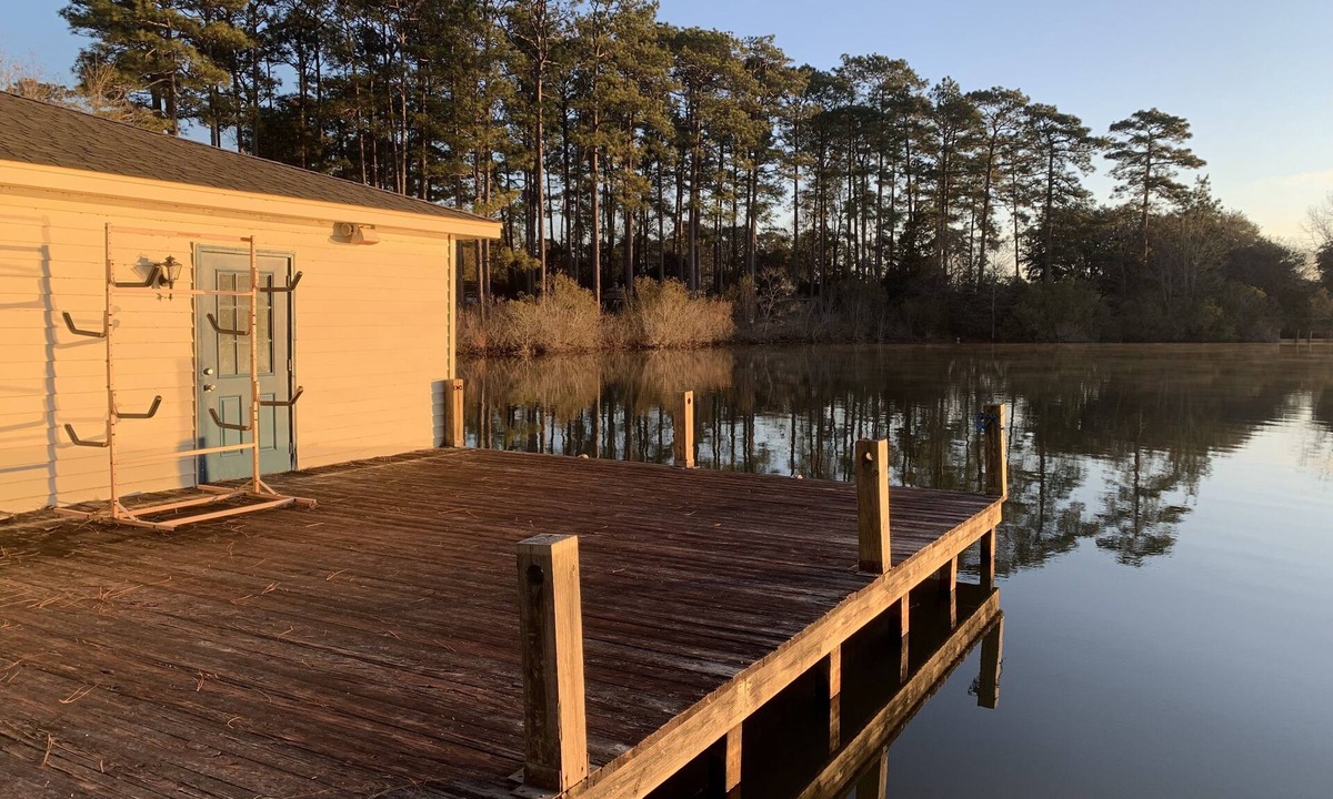 Hattiesburg House | Lakeside pavilion on private lake with a boathouse, outdoor fireplace, kayaks.