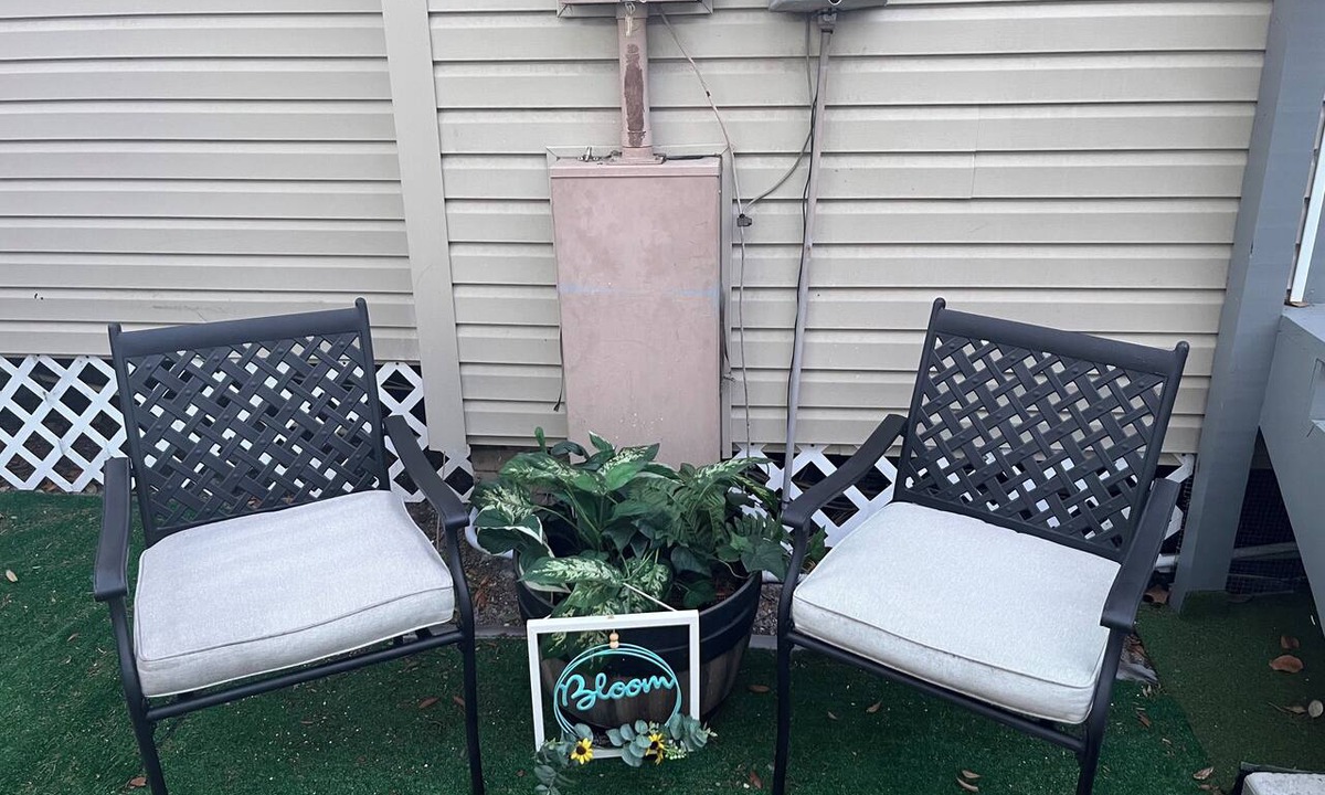 Tampa Heights House | Location Location Mini Jr. Suite. 1-bedroom queen bed behind barn doors.