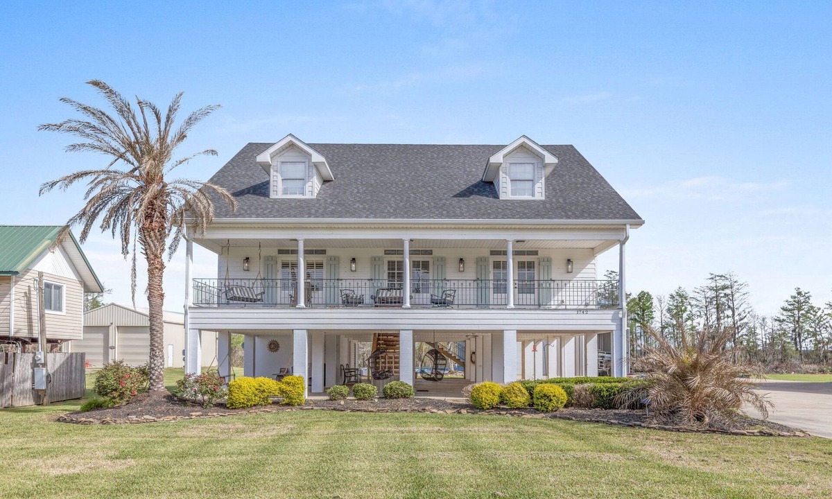 Moss Bluff House | Luxury riverfront home w/pool, fishing dock, & boat house w/lift ! Sleeps 14