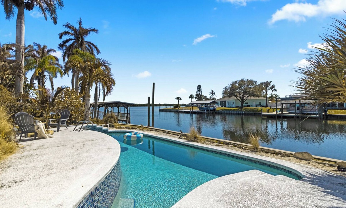 Catalina Isle Estates House | Merritt Island Waterfront Home W/Screened Patio, Private Pool, BBQ Grill, and Pool Table! 🌅🌴