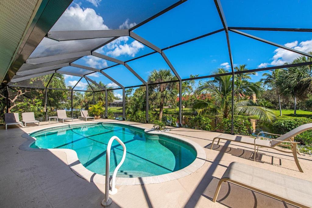 Palm River Estates Villa | Palms and Pool home in Naples best beaches and national parks