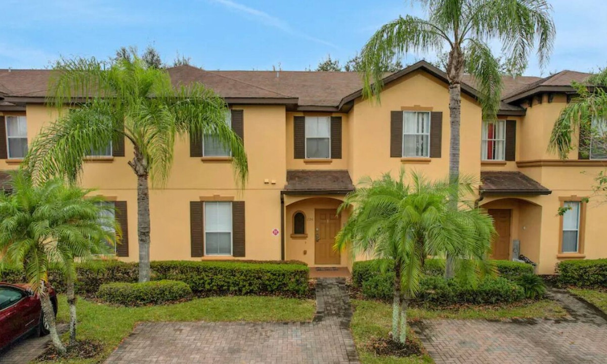Regal Palms Villa | Resort townhome with patio, on-site pool and hot tub, gym, pool table, AC & W/D