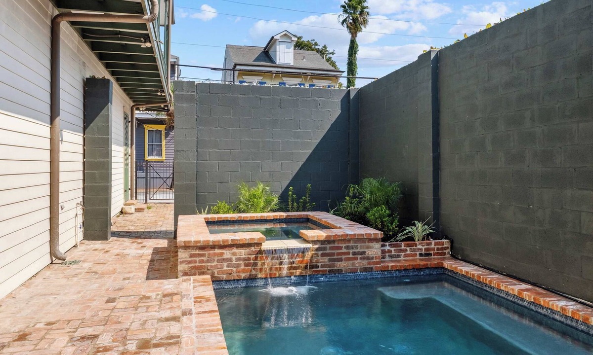 Seventh Ward House | Rustic Industrial Home w heated Pool/Hot Tub, Steps to FQ