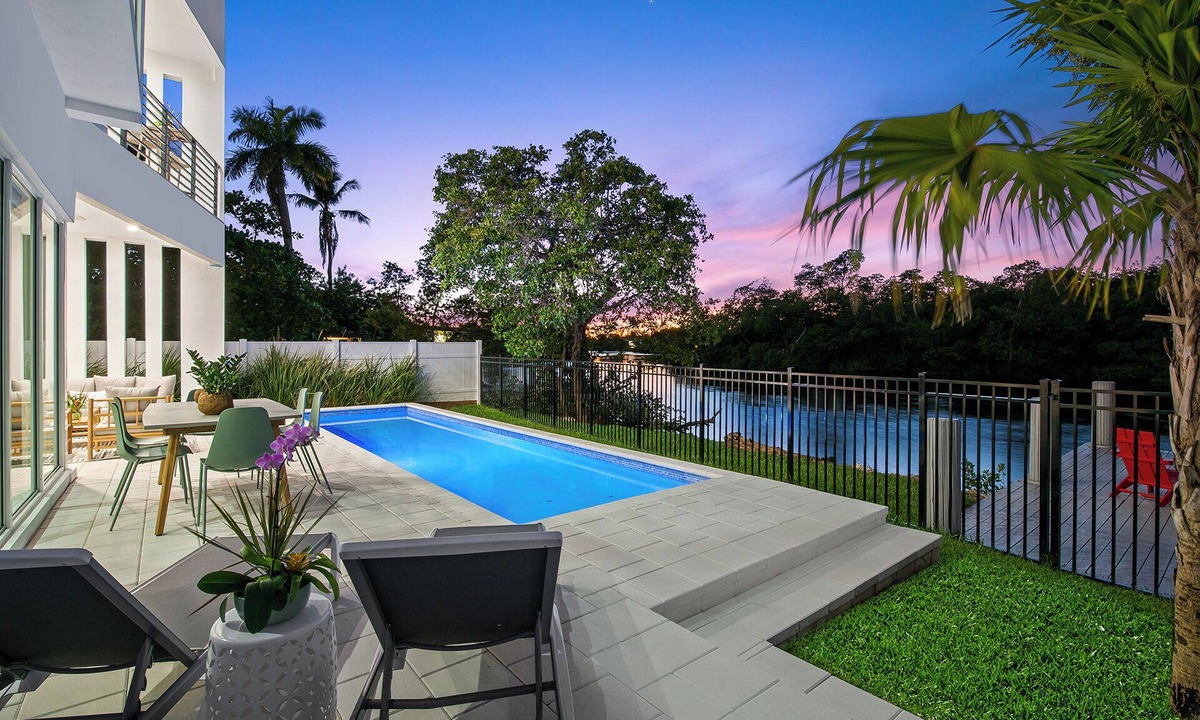 Middle River Terrace House | Stunning Modern Heated Pool Retreat with Scenic Waterway Views Near Beaches!