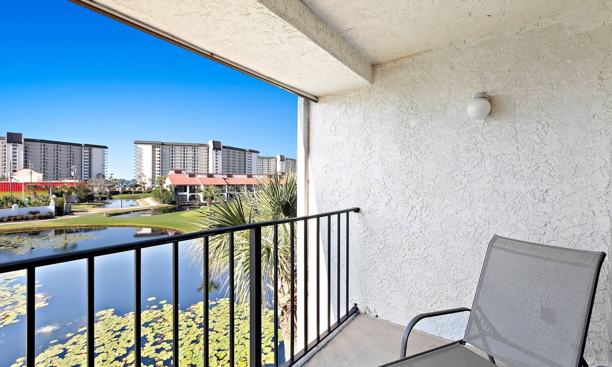 Panama City Beach Condo | Two-level waterfront condo near beach with balcony, patio, pool & hot tub