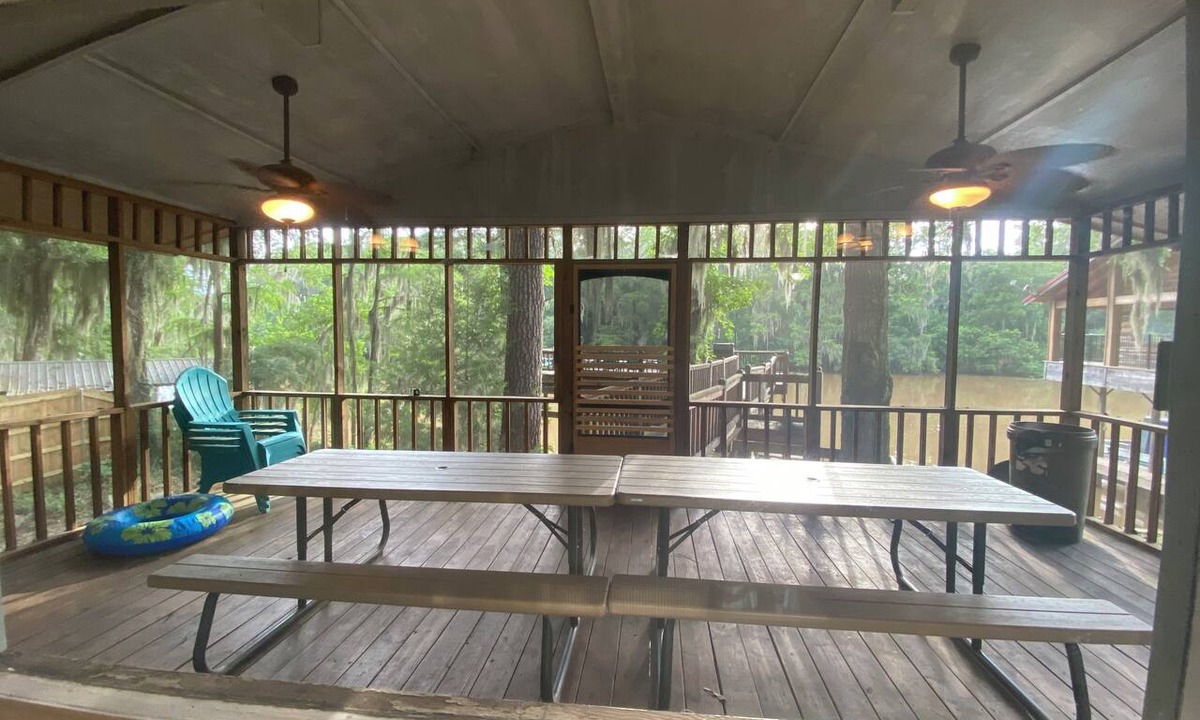 Karnack House | Two Story House with deck over the river