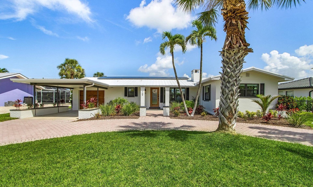 South Island House | Waterfront Beach-Style Retreat with Pool, Dock & Game Room in Fort Myers