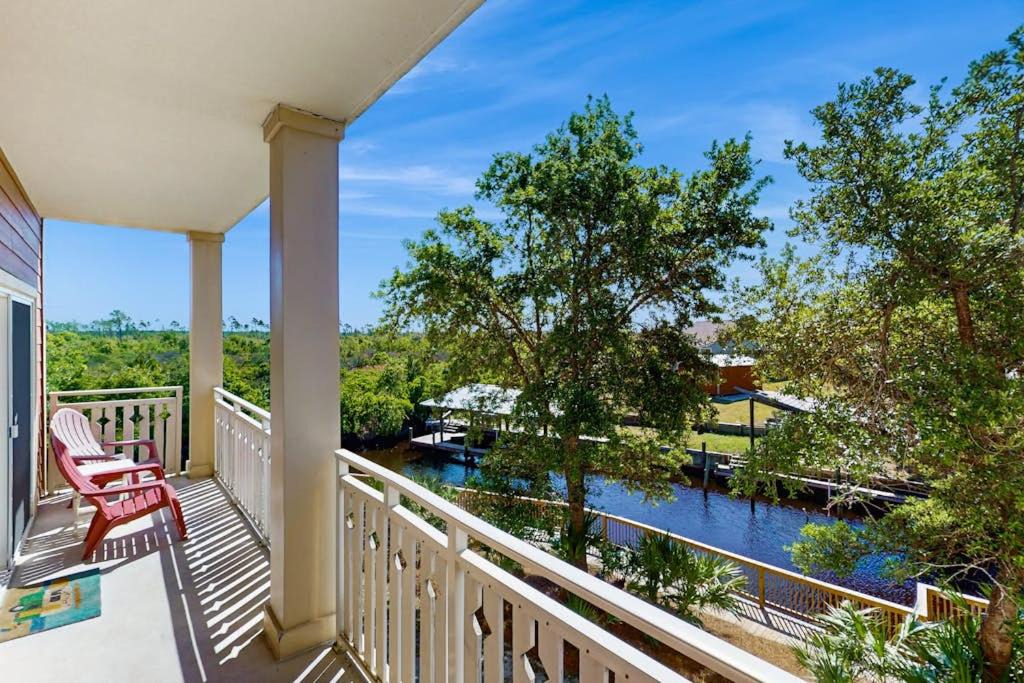 Waterside Village House | Waterfront Home Close to Beach with Shared Pool Hot Tub Free WiFi & Central AC