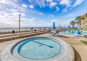 Bright condo on the Gulf with pool, beach access, hot tub, balcony & central AC