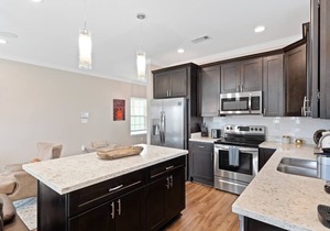 Modern 4BR Mid-City home with heated pool & balcony. Free parking, walk to streetcar & parades.