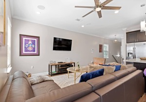 Modern 4BR Mid-City home with heated pool & balcony. Free parking, walk to streetcar & parades.