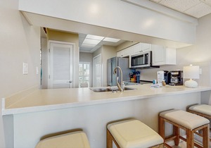 Open-concept beachfront home with balcony, lagoon pool, beach access, pickleball