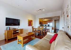 Polished condo with balcony & pools - one block from the beach