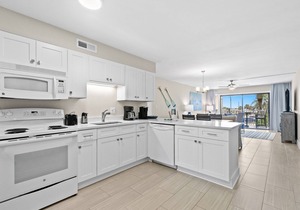 Second floor condo with pool access, ccean view, WiFi, W/D, and central AC