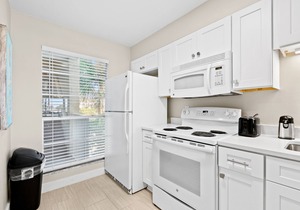 Second floor condo with pool access, ccean view, WiFi, W/D, and central AC