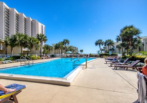 Second floor condo with pool access, ccean view, WiFi, W/D, and central AC