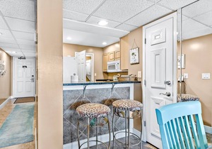 Two-level waterfront condo near beach with balcony, patio, pool & hot tub
