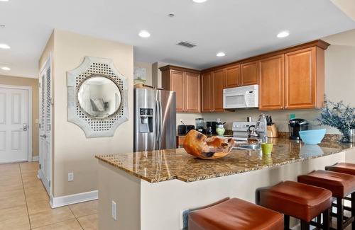 Upper Grand Lagoon Condo | Bayfront, 4th-floor condo with hot tub, pool & views of Nicklaus Golf Course