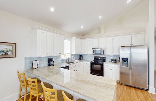 Plantation House | Beachfront home with a pool, game room, deck, grill, washer/dryer & central AC