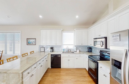 Plantation House | Beachfront home with a pool, game room, deck, grill, washer/dryer & central AC
