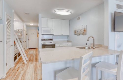 Fort Bay House | Beautiful beachfront condo with shared pool/hot tub and beach access