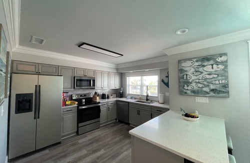 Holiday Isle House | Boaters paradise 4 bedroom 3 bath with 50' ft BOAT SLIP! Beach access