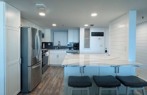 Thomas Drive Condo | Emerald Water & Sugar White Sand Awaits You! Beachfront Condo, Pool