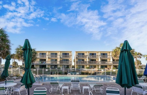St. George Island Condo | Located right on the beachfront, this bright, cheerful and beautiful well-appointed Villa.