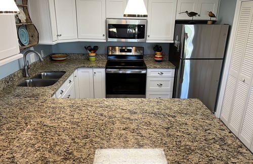 Gulf Place Condo | Perfect Beach Getaway! 2 BR 2 BA Ground floor End Unit! Steps From The Beach!