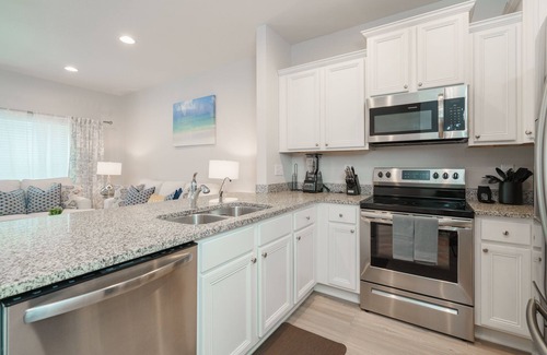 Thomas Drive House | Pride of PCB | 3BR Townhome, Pool Access, Patio, Near Beach, Sleeps 10