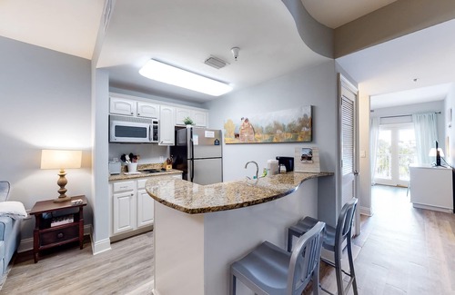 Sunnyside Apartment | Stylish condo with lake views, bike rentals, & pools - walk to the beach