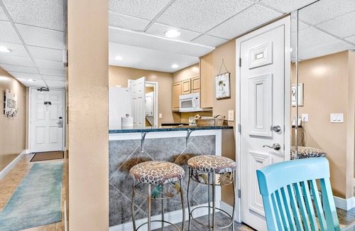 Panama City Beach Condo | Two-level waterfront condo near beach with balcony, patio, pool & hot tub