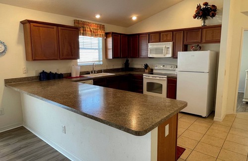 Lake Sumter Landing House | Walking distance to Lake Sumter Landing! Small Dog Friendly Villa w/Golf Cart