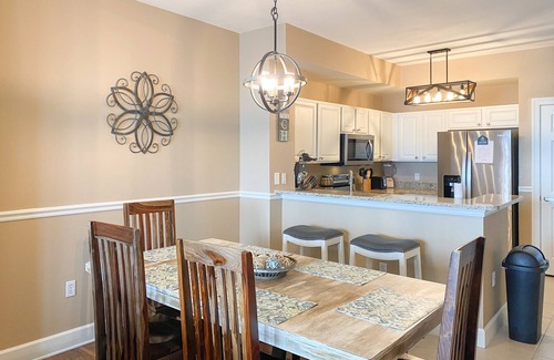 Panama City Beach Condo | Welcoming waterfront condo with a furnished balcony, pool & pool spa