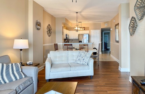 Panama City Beach Condo | Welcoming waterfront condo with a furnished balcony, pool & pool spa