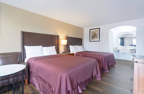 San Augustine Hotel | 2 Rooms for Great Value: 2 Full Beds Non-Smoking for 4 Guests.