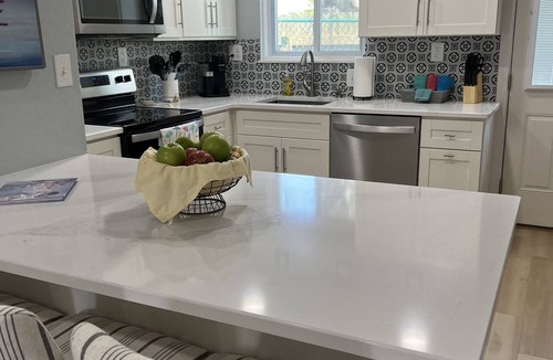 Silver Sands Beach Condo | 2022 Renovation! Surf side and stones throw from the beach!