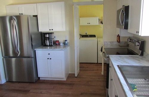 Barefoot Bay House | 3 Bedroom Home, Lots of Room Pools, golf course, Fishing Pier and Private Beach.
