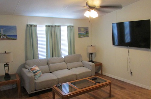 Barefoot Bay House | 3 Bedroom Home, Lots of Room Pools, golf course, Fishing Pier and Private Beach.