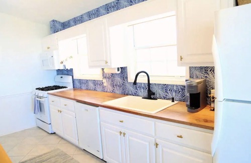 Riviera Beach House | 4-bedroom house, Heated Pool, Hot Tub, 6 person Golf Cart. 2 blocks from beach.