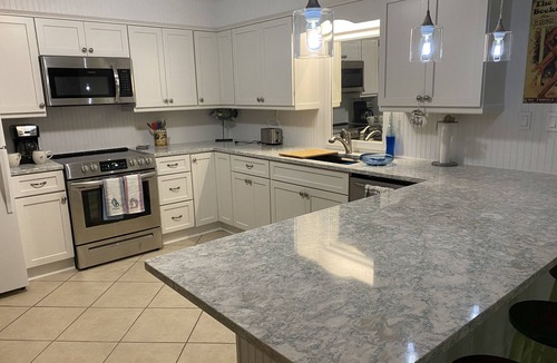 East End Condo | Adorable Beach Cottage. Full size swimming pool shared by four units in building