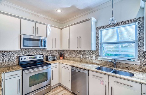 Sugarwood Beach House | Backyard Oasis with Heated Pool. 2 Minutes to Beach. Great for Large Groups.