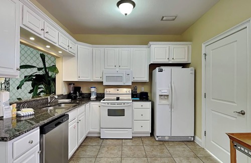 Sunset Pass House | Banana Bay Townhome 6075 | Pet-Friendly, Short Drive to Beach, On-Site Amenities
